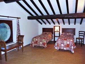 Ένα ή περισσότερα κρεβάτια σε δωμάτιο στο Cosy apartment in Mantignana with private terrace