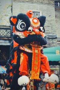 a group of people dressed in costumes in a parade at Hilton Foshan - Free Shuttle Bus to Canton Fair in Foshan