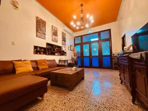 a living room with a couch and a coffee table at Liu Xu Homestay in Tainan