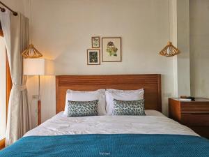 a bedroom with a bed with two pillows at Baan Rai good view cafe&Resort in Mae Suai +60 photos