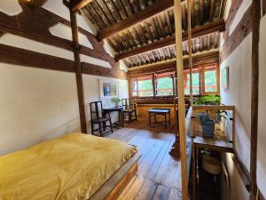 Postel nebo postele na pokoji v ubytování Secret Moon Guesthouse