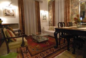 A seating area at Central Athens Period House with Pool