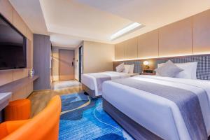 Postel nebo postele na pokoji v ubytování Shangpin Holiday Inn - Guangzhou New Baiyun International Airport Flagship Store
