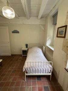 Postel nebo postele na pokoji v ubytování Domaine de Rogemont