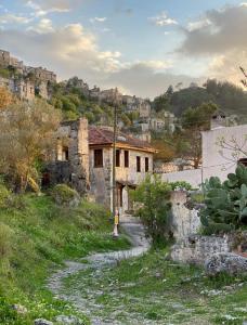 an old building on the side of a hill at Arzu Cottage in Fethiye
