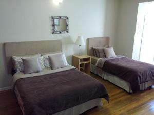 Uma cama ou camas num quarto em Uitenhage Apartments