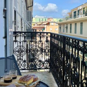 a plate of food on a table on a balcony at Sul Corso Sanremo in Sanremo