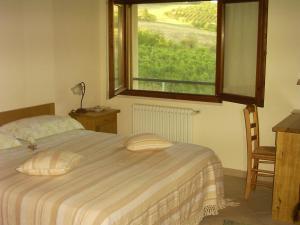 Ένα ή περισσότερα κρεβάτια σε δωμάτιο στο Agriturismo Macìn
