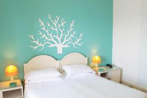 Postel nebo postele na pokoji v ubytování Sunbay Park Hotel