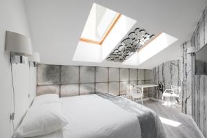 Кровать или кровати в номере Арт Отель Че