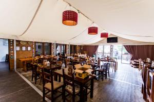 a dining room with tables and chairs in a tent at The Star Inn in Nottingham