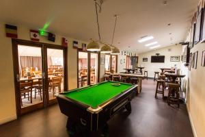 a room with a pool table in a restaurant at The Star Inn in Nottingham