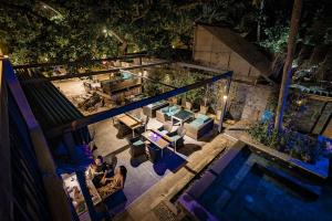 an overhead view of a swimming pool at night at 15 Palms Beach Resort in Ko Chang