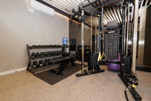 a fitness room with a lot of exercise equipment at Princess Palm on the Beach in Gold Coast