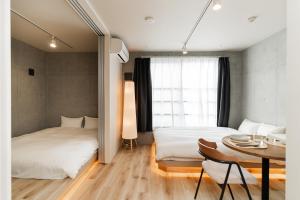 Postel nebo postele na pokoji v ubytování Tabiya Shinamachi - New built APT at Ikebukuro, Relaxing Stay in Central Tokyo