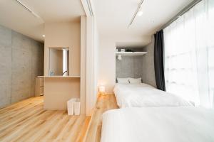 Postel nebo postele na pokoji v ubytování Tabiya Shinamachi - New built APT at Ikebukuro, Relaxing Stay in Central Tokyo