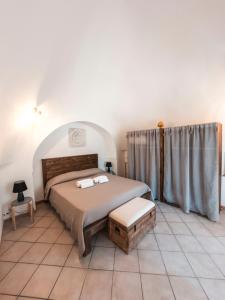 Postel nebo postele na pokoji v ubytování Trulli Mamima