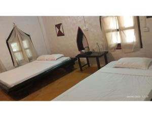 Postel nebo postele na pokoji v ubytování Desia Duduma, Puri