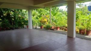 a room filled with lots of potted plants at Indeevaram Residency in Trivandrum