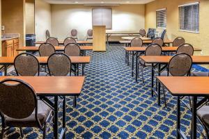 an empty classroom with desks and chairs at Quality Inn & Suites in Seville +40 photos