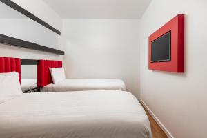 Postel nebo postele na pokoji v ubytování Tune Hotel Liverpool