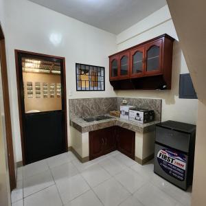 Kuchyň nebo kuchyňský kout v ubytování Dapdap's Townhouse