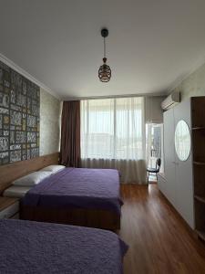 Postel nebo postele na pokoji v ubytování Hotel Arev Kobuleti