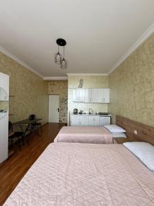 Postel nebo postele na pokoji v ubytování Hotel Arev Kobuleti