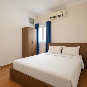 Postel nebo postele na pokoji v ubytování Rosa Hotel - Bùi Viện walking street