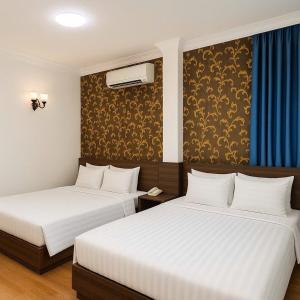 Postel nebo postele na pokoji v ubytování Rosa Hotel - Bùi Viện walking street