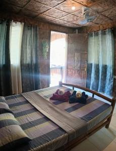 Postel nebo postele na pokoji v ubytování Malapascua Hideaway Resort