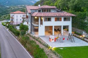 a house on the side of a road at Infinity View Garda lake in Tenno