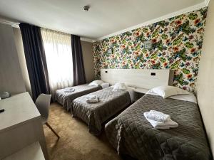 Postel nebo postele na pokoji v ubytování Grand Master Hotel + 37 fotografií