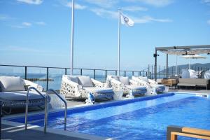 a pool on the top of a cruise ship at awaJ Beach Club アワジェイビーチクラブ in Awaji