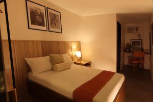 Postel nebo postele na pokoji v ubytování Casa Charlie B&B
