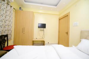 Hotel Airport residency客房内的一张或多张床位