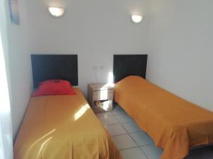 two beds sitting next to each other in a room at Les pieds dans l'eau ! in Cerbère +23 photos