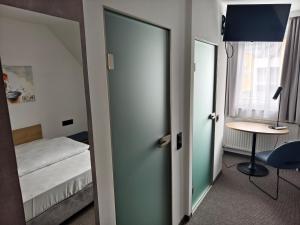 Łóżko lub łóżka w pokoju w obiekcie Hotel Anker