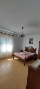 a bedroom with a bed in a room at Casa do Vale in Arcos de Valdevez +5 photos