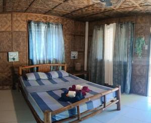 Postel nebo postele na pokoji v ubytování Malapascua Hideaway Resort