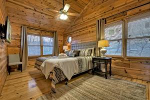 a bedroom with a bed in a log cabin at Appalachian Sunrise Amazing views Close to Blue Ridge hike from the cabin in Blue Ridge