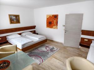 Łóżko lub łóżka w pokoju w obiekcie Hotel Anker