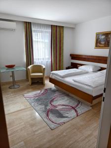 Łóżko lub łóżka w pokoju w obiekcie Hotel Anker