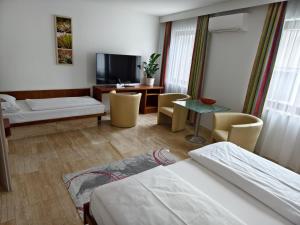 Łóżko lub łóżka w pokoju w obiekcie Hotel Anker
