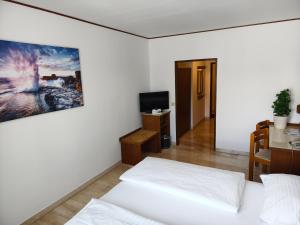 Łóżko lub łóżka w pokoju w obiekcie Hotel Anker