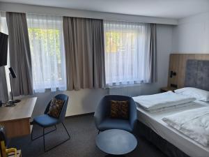 Łóżko lub łóżka w pokoju w obiekcie Hotel Anker