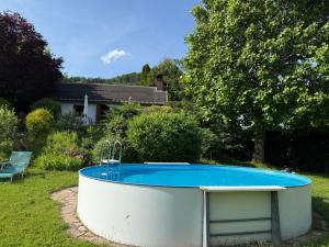 a swimming pool in a yard with at Ferienhaus Donaublick in Weins