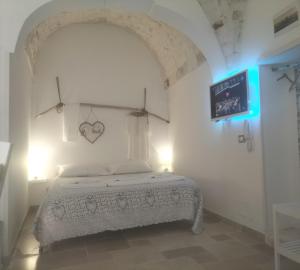 Postel nebo postele na pokoji v ubytování Le TRE ALCOVE