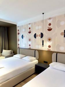 Katil atau katil-katil dalam bilik di Monun Hotel