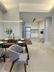 a kitchen and dining room with a table and chairs at KL Central 33rd Floor KLCC view in Kuala Lumpur